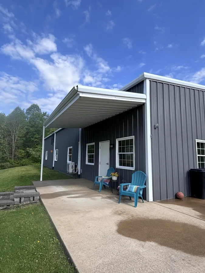 Metal pole barn after wash — covered porch
