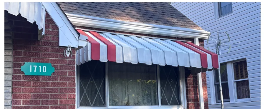 Striped window awning cleaning