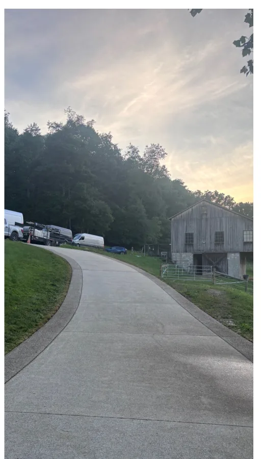Long concrete driveway to barn after cleaning
