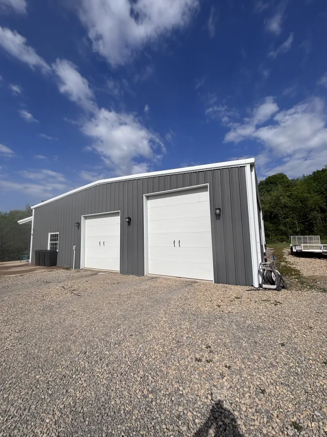 Metal pole barn after wash — garage doors